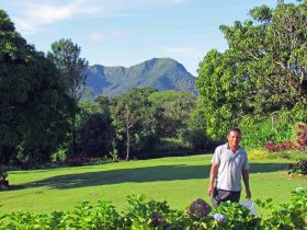 El Valle, Panama lawn, with man, and mountain in background – Best Places In The World To Retire – International Living